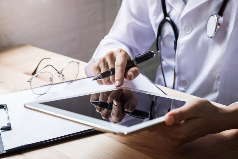 Doctor using a digital tablet in the hospital, Healthcare and Medicine concept.