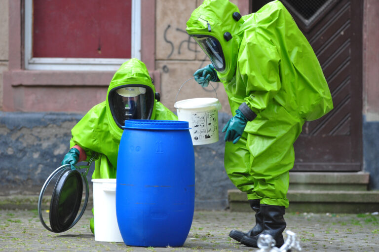Frankfurt, Germany - July 1, 2009: Chemical experts exploring site at school after accident