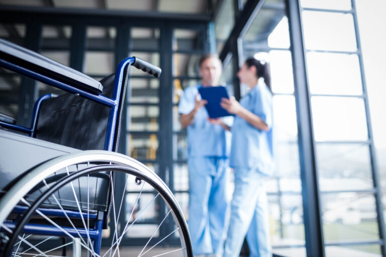 Nurse staff bringing a wheelchair at the hospital